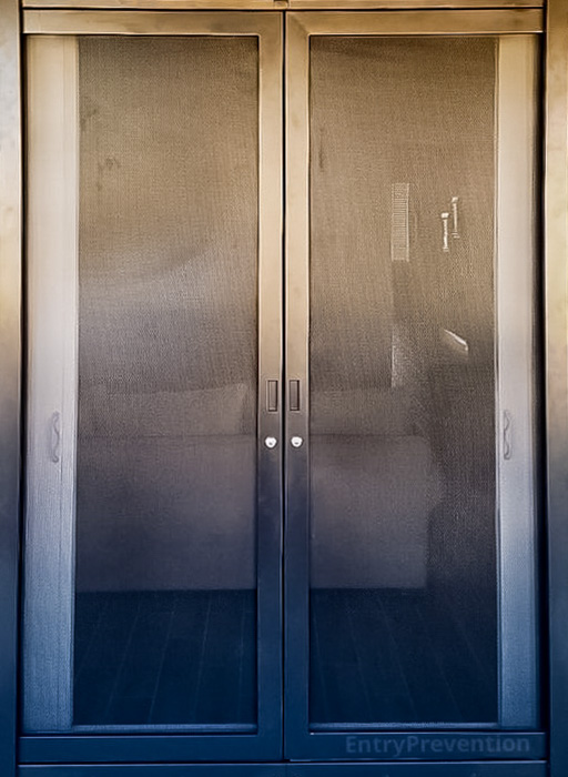 Dark brown french security screen door with scroll plasma art design